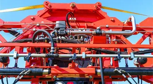 Hydraulic system, steel tubes, industrial tools equipment on agricultural machinery tractor or harvester, close up