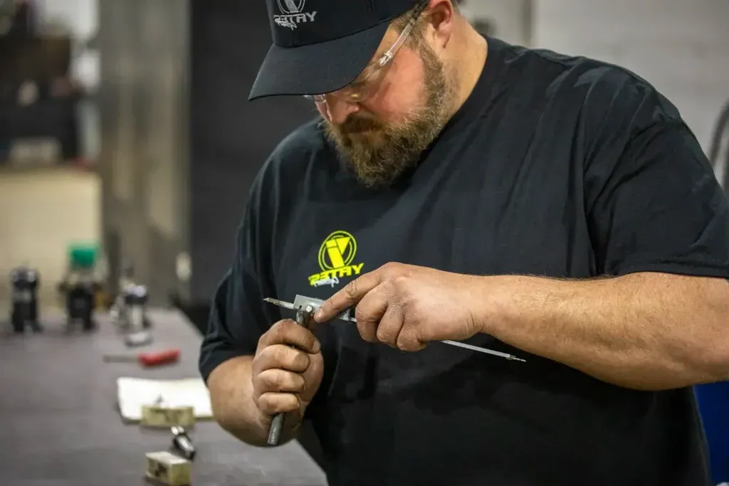 Man using tool for repairing cylinders